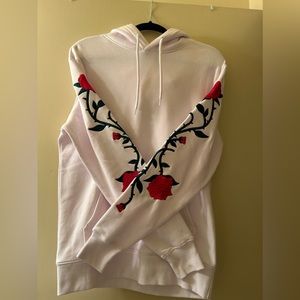 Embroidered roses on the sleeves, size S